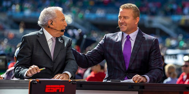 ESPN College Gameday host Lee Corso and Kirk Herbstreit talk prior to a college football game between the Notre Dame Fighting Irish and the Wisconsin Badgers on September 25th, 2021 at Solider Field in Chicago, IL. 