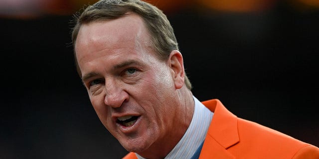 Former Denver Broncos quarterback Peyton Manning speaks during a ceremony to reveal his name on the stadium Ring of Fame at halftime during a game between the Denver Broncos and the Washington Football Team at Empower Field at Mile High Oct. 31, 2021, in Denver. 