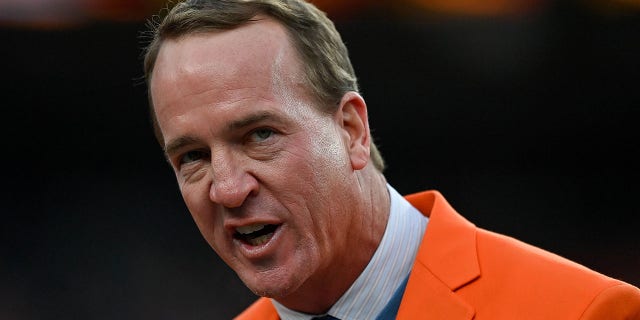 Former Denver Broncos quarterback Peyton Manning speaks during a ceremony to reveal his name on the Stadium Ring of Fame during a game between the Denver Broncos and Washington football team at Empower Field on October 31, 2021 in Denver.