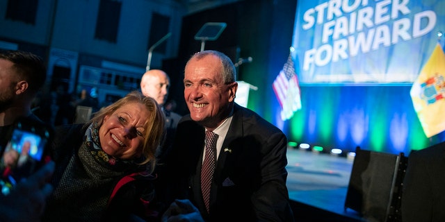 New Jersey Gov.  Phil Murphy greets supporters after delivering a victory speech to supporters at the Grand Arcade at the Pavilion on November 3, 2021, in Asbury Park, New Jersey. 