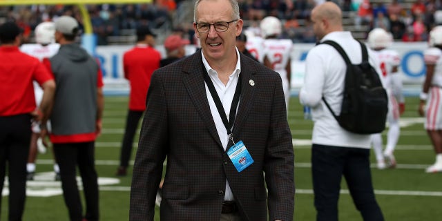 SEC Commissioner Greg Sankey is on the field for pre-game warm ups at the TicketSmarter Birmingham Bowl between the Houston Cougars and the Auburn Tigers on December 28, 2021 at Protective Stadium in Birmingham, Alabama.  