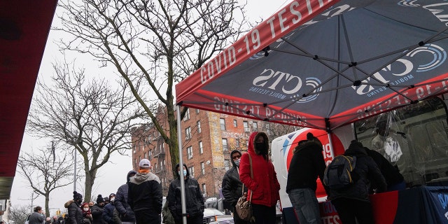 People wait for COVID-19 test in the Queens borough of New York on Dec. 29, 2021. 