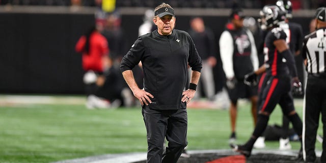 New Orleans head coach Sean Payton watches his team warm up prior to the start of the NFL game between the New Orleans Saints and the Atlanta Falcons on Jan. 9, 2022 at Mercedes-Benz Stadium in Atlanta.  