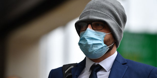 On-duty Metropolitan Police officer Jonathon Cobban arrives at Westminster Magistrates' Court, London, on March 16, 2022 to face charges over allegations he shared racist and misogynistic messages during a WhatsApp conversation with Sarah Everard's killer, Wayne Couzens.