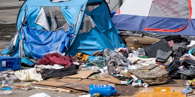 Los Angeles, CA - March 17: Tents and belongings at a homeless encampment in Toriumi Plaza at 1st St and Judge John Aiso St in Los Angeles Thursday, March 17, 2022.  