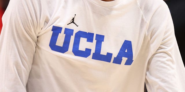 Peyton Watson, #23 of the UCLA Bruins, wears a shirt with the Jordan Jumpman logo before the UCLA Bruins take on the St. Mary's Gaels during the second round of the 2022 NCAA Men's Basketball Tournament held at the Moda Center on Mar. 19, 2022 in Portland, Oregon. 