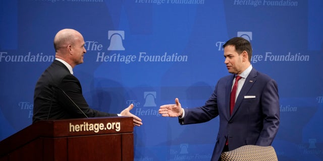President of the Heritage Foundation Dr. Kevin Roberts shakes hands with Sen. Marco Rubio 