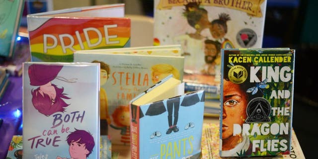Children books that are fighting for survival at public schools because of their LGBTQ content are displayed at the annual Pride Town Hall at Walter Johnson High School in Bethesda, MD, May 21, 2022. (Photo by Astrid Riecken for The Washington Post via Getty Images)