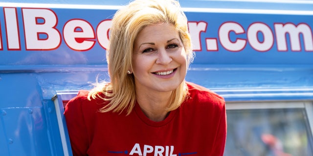 Republican candidate for U.S. Congress April Becker poses in the window of her campaign van, a converted ice cream truck, in Las Vegas on Sunday, May 29, 2022.