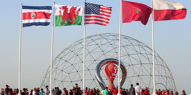 A general view shows flags of (L to R) Costa Rica, Wales, the United States, Morocco, and Poland, nations which qualified for the 2022 World Cup in the Qatari capital Doha during a flag-raising ceremony of the last remaining countries to qualify, on June 16, 2022.