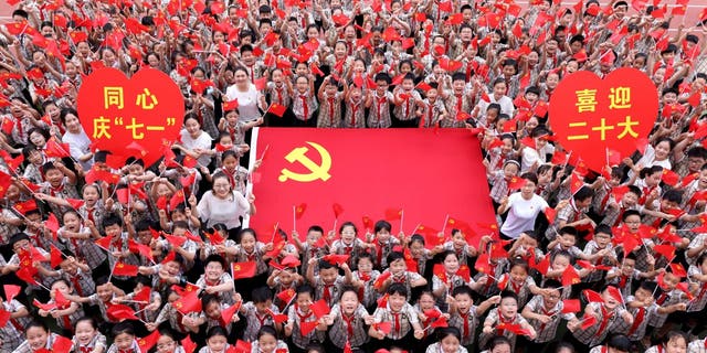 Teachers and students sing together to celebrate the founding day of the Communist Party of China (CPC) at Wenhua Road Primary School in Zaozhuang, East China's Shandong Province, June 22, 2022.