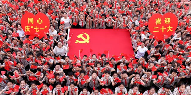 Teachers and students sing together to celebrate the founding day of the Communist Party of China (CPC) at Wenhua Road Primary School in Zaozhuang, East China's Shandong Province, June 22, 2022.