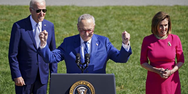 President Biden, Senate Majority Leader Chuck Schumer and House Speaker Nancy Pelosi at a signing ceremony at the White House on Aug. 9, 2022.
