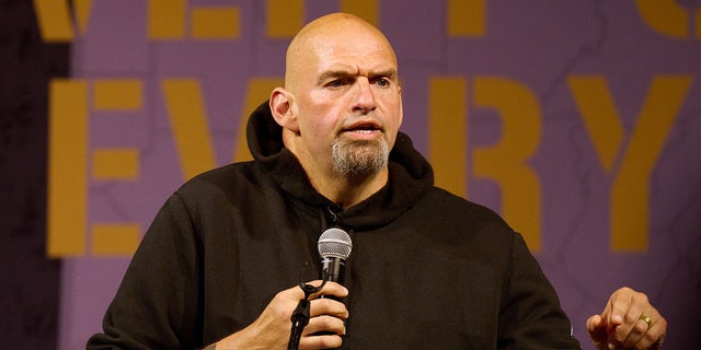 Lieutenant Governor of Pennsylvania and Democratic US Senate candidate John Fetterman addresses supporters during a rally on August 12, 2022 in Erie, Pennsylvania. - The event marked Fettermans first campaign rally since suffering a stroke caused by a blood clot on May 15, 2022. 