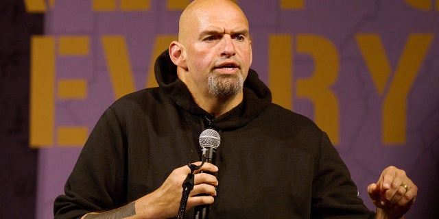 Lieutenant Governor of Pennsylvania and Democratic US Senate candidate John Fetterman addresses supporters during a rally on August 12, 2022 in Erie, Pennsylvania. - The event marked Fettermans first campaign rally since suffering a stroke caused by a blood clot on May 15, 2022. 