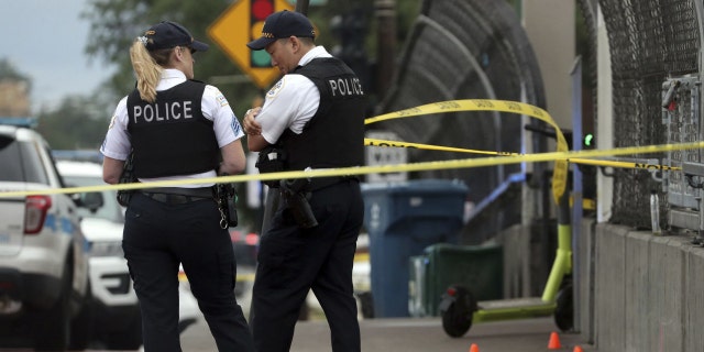 Chicago police stand near a crime scene