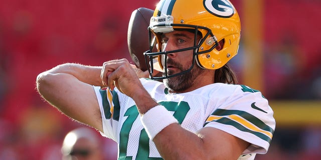 Green Bay Packers quarterback Aaron Rodgers, #12, throws a pass before an NFL preseason game between the Green Bay Packers and Kansas City Chiefs on August 25, 2022, at GEHA Field at Arrowhead Stadium in Kansas City, Missouri. 