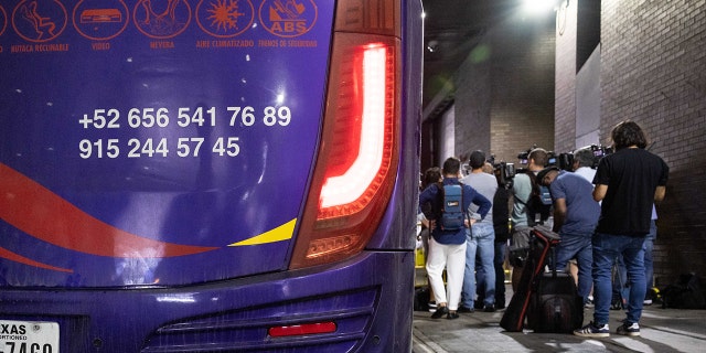 A bus transports migrants from Texas to the Port Authority Bus Terminal in New York, US, Tuesday, Aug. 30, 2022. 