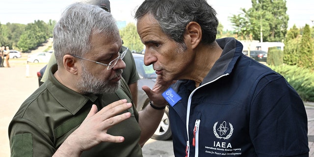 International Atomic Energy Agency (IAEA) chief Rafael Grossi, right, talks to Ukainian Minister of Energy German Galushchenko, left, after the arrival of the IAEA inspection mission to Zaporizhzhia, on August 31, 2022. 
