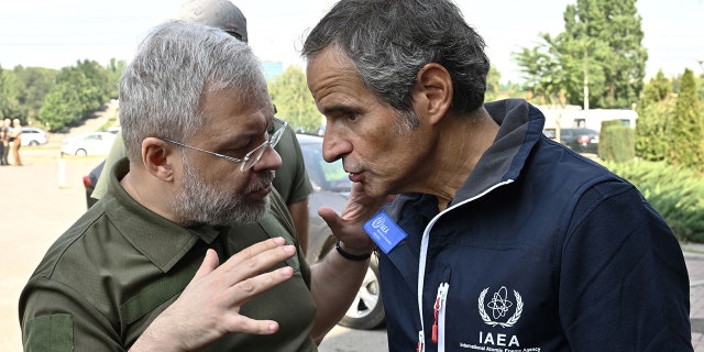 International Atomic Energy Agency (IAEA) chief Rafael Grossi, right, talks to Ukainian Minister of Energy German Galushchenko, left, after the arrival of the IAEA inspection mission to Zaporizhzhia, on August 31, 2022. 