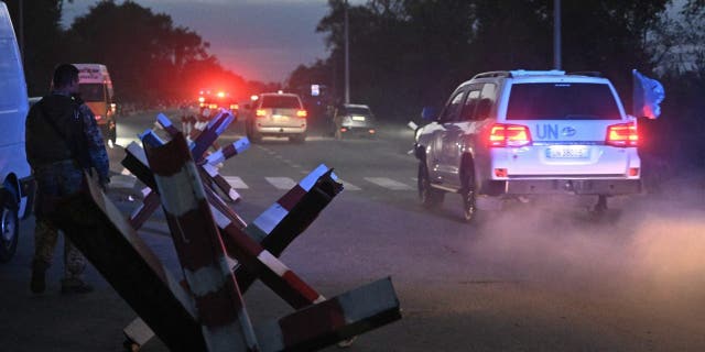 UN vehicles transporting members of International Atomic Energy Agency (IAEA) inspection mission drive on a road outside Zaporizhzhia city, after their visit to the Russian-held Zaporizhzhia nuclear power plant in southern Ukraine on Sept. 1, 2022, amid the Russian invasion of Ukraine.