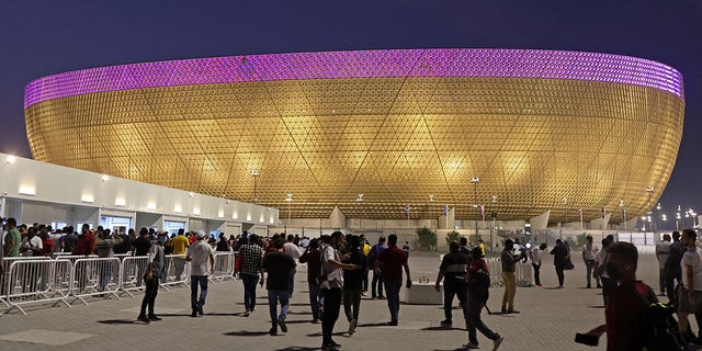 People arrive at the Lusail Stadium on the outskirts of Qatar's capital Doha on September 2, 2022, ahead of the orientation event for the FIFA World Cup Qatar 2022 Volunteers Program. 