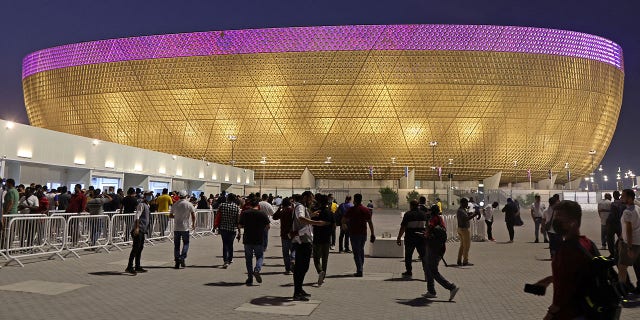 People arrive at the Lusail Stadium on the outskirts of Qatar's capital Doha on September 2, 2022, ahead of the orientation event for the FIFA World Cup Qatar 2022 Volunteers Program.