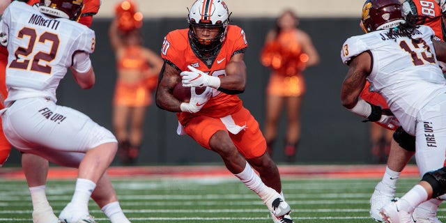 Oklahoma State Cowboys running back Dominic Richardson (20) looks for an opening during a game against the Central Michigan Chippewas Sept. 1, 2022, at Boone Pickens Stadium in Stillwater, Okla. 