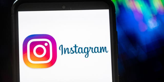 In this photo illustration a Instagram logo seen displayed on a smartphone.