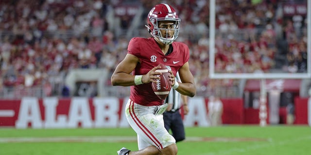 Bryce Young of the Alabama Crimson Tide runs for a touchdown against the Utah State Aggies at Bryant Denny Stadium Sept. 3, 2022, in Tuscaloosa, Ala. 