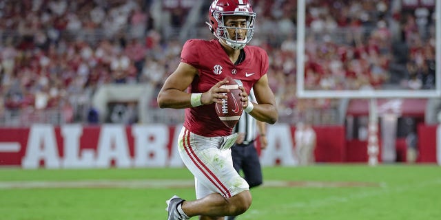 Bryce Young of the Alabama Crimson Tide runs for a touchdown against the Utah State Aggies at Bryant Denny Stadium Sept. 3, 2022, in Tuscaloosa, Ala. 