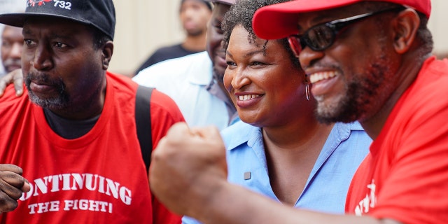 Democratic gubernatorial candidate for Georgia, Stacey Abrams, poses for photos at a Labor Day picnic on September 5, 2022, in Atlanta.