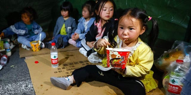 Earthquake-affected residents rest in a tent at a temporary shelter in Moxi Town of Luding County, southwest China's Sichuan Province, Sept. 5, 2022.