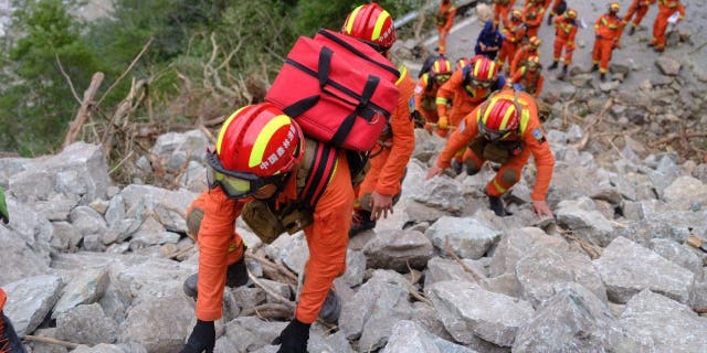 Rescuers search and evacuate injured people in Luding county, Ganzi prefecture, Southwest China's Sichuan province, Sept. 6, 2022.