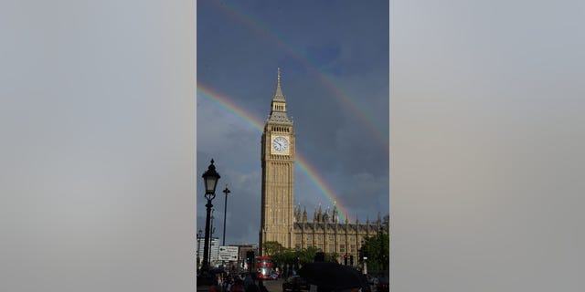 After a rain shower at the Elizabeth Tower in Westminster, London, mourners meet Queen Elizabeth II. A double rainbow was seen as they gathered to mourn Elizabeth's death. 8, 2022.