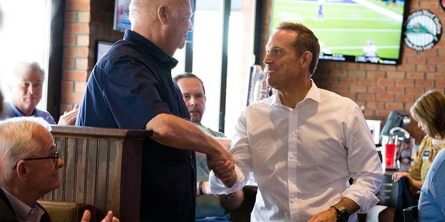Trump-backed Senate candidate Ted Budd greets an attendee during a campaign event in Greensboro, North Carolina, on Friday, Sept. 9, 2022. 