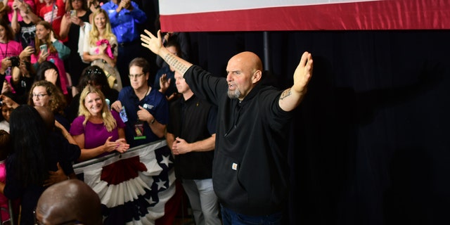 Democratic Senate nominee John Fetterman acknowledges supporters during a rally with U.S. Reps. Madeleine Dean and Mary Gay Scanlon at Montgomery County Community College in Blue Bell on Sept. 11, 2022 .