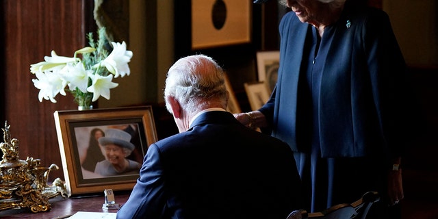King Charles III signed the visitor’s book at Hillsborough Castle in Belfast during his visit to North Ireland. 