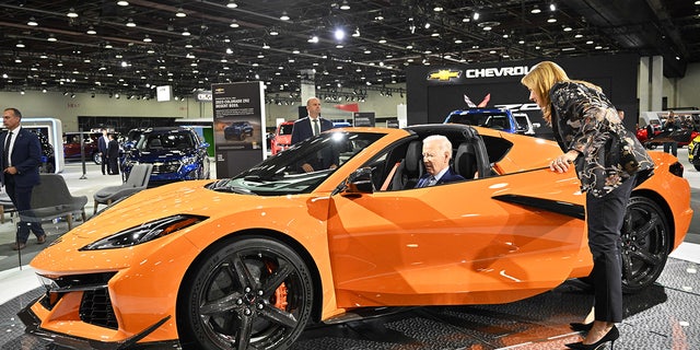 US President Joe Biden, with General Motors CEO Mary Barra, sits in a Chevrolet Corvette Z06 as he tours the 2022 North American International Auto Show at Huntington Place Convention Center in Detroit, Michigan on September 14, 2022.