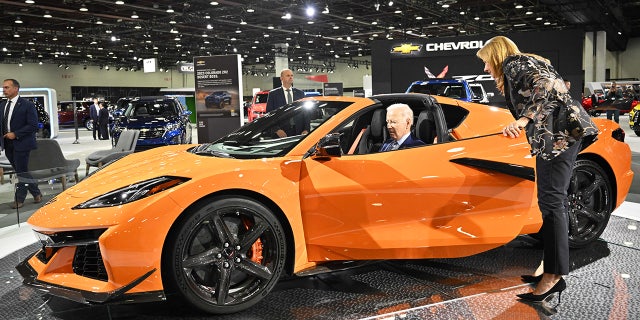US President Joe Biden, with General Motors CEO Mary Barra, sits in a Chevrolet Corvette Z06 as he tours the 2022 North American International Auto Show at Huntington Place Convention Center in Detroit, Michigan on September 14, 2022.