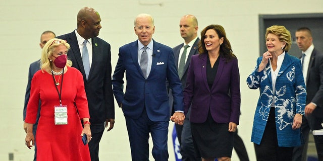 Rep. Debbie Dingell, President of the United Auto Workers Ray Curry, President Joe Biden, Michigan Gov. Gretchen Whitmer and Sen. Debbie Stabenow, arrive to tour the 2022 North American International Auto Show in Detroit, Michigan, on September 14, 2022.