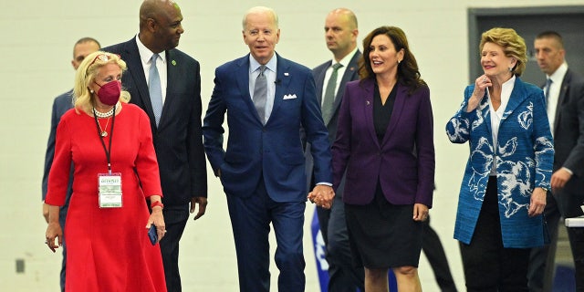 Rep. Debbie Dingell, President of the United Auto Workers Ray Curry, President Joe Biden, Michigan Gov. Gretchen Whitmer and Sen. Debbie Stabenow, arrive to tour the 2022 North American International Auto Show in Detroit, Michigan, on September 14, 2022.