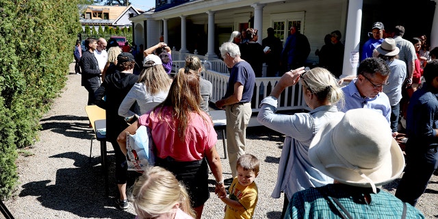 Martha's Vineyard, MA - September 15: Marthas Vineyard residents line up in front of St. Andrews Parish House to donate food to the recently arrived migrants. Two planes of migrants from Venezuela arrived suddenly Wednesday night on Martha's Vineyard.