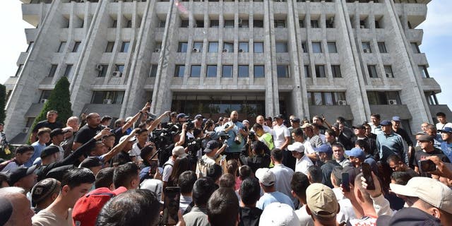 Protesters gather near the Kyrgyz Parliament building in Bishkek to call on the authorities to help residents of Batken province in southern Kyrgyzstan, following border clashes with Tajik forces, September 16, 2022.