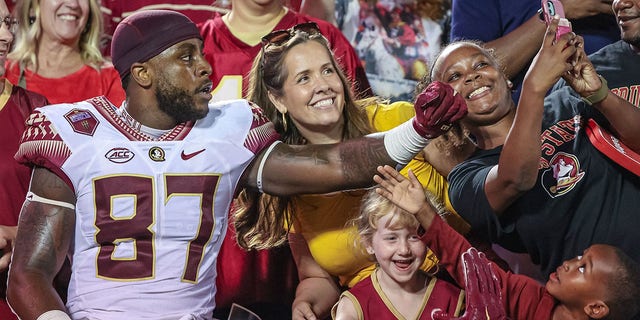Camren McDonald of the Florida State Seminoles celebrates with fans after a game against the Louisville Cardinals at Cardinal Stadium Sept. 16, 2022, in Louisville, Ky. 