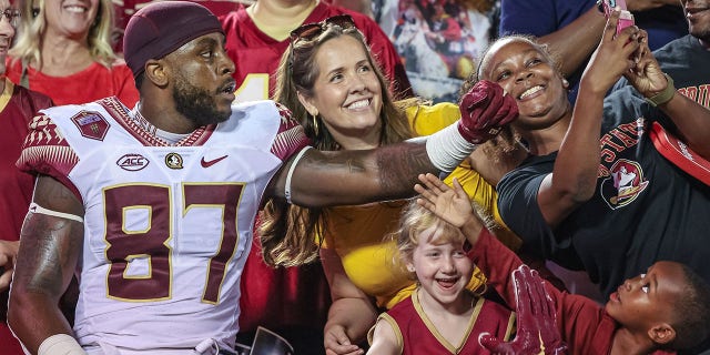 Camren McDonald of the Florida State Seminoles celebrates with fans after a game against the Louisville Cardinals at Cardinal Stadium Sept. 16, 2022, in Louisville, Ky.