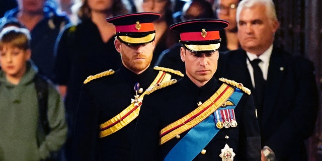 At the Queen's vigil, her two grandsons Prince Harry and Prince William wore noticeably different uniforms, and only one had the "ER" initials on his suit.