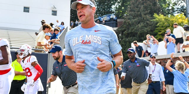 Ole Miss head coach Lane Kiffin runs onto the field before the start of the NCAA football game between the Ole Miss Rebels and the Georgia Tech Yellow Jackets on September 29. February 17, 2022 at Bobby Dodd Stadium in Atlanta.