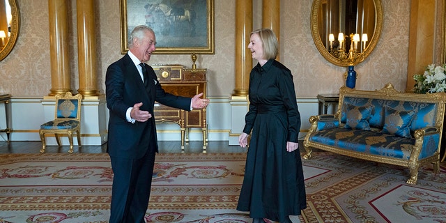 King Charles III greets Prime Minister Liz Truss in the 1844 Room at Buckingham Palace ahead of other dignitaries arriving to Westminster Hall on Sunday. 