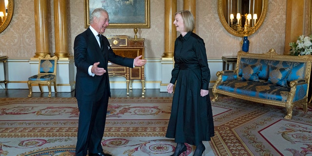 King Charles III greets Prime Minister Liz Truss in the 1844 Room at Buckingham Palace ahead of other dignitaries arriving to Westminster Hall on Sunday.
